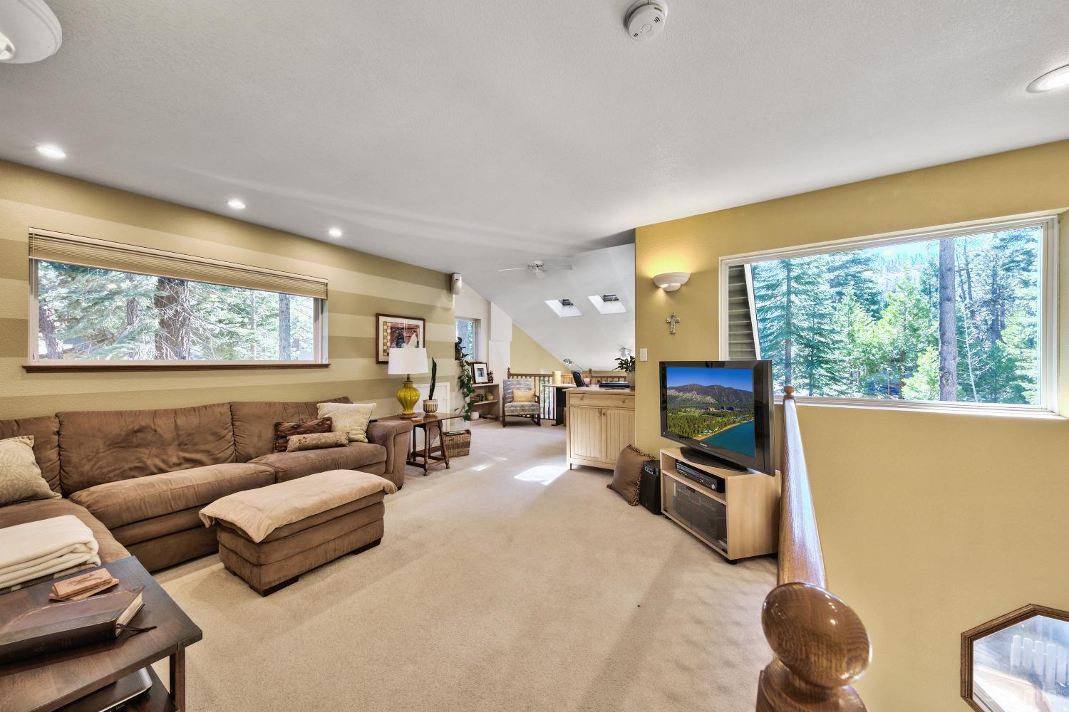 712 Sand Harbor Road South Lake Tahoe, CA 96150 - Photo 20 of 38 a living room with furniture and a large window