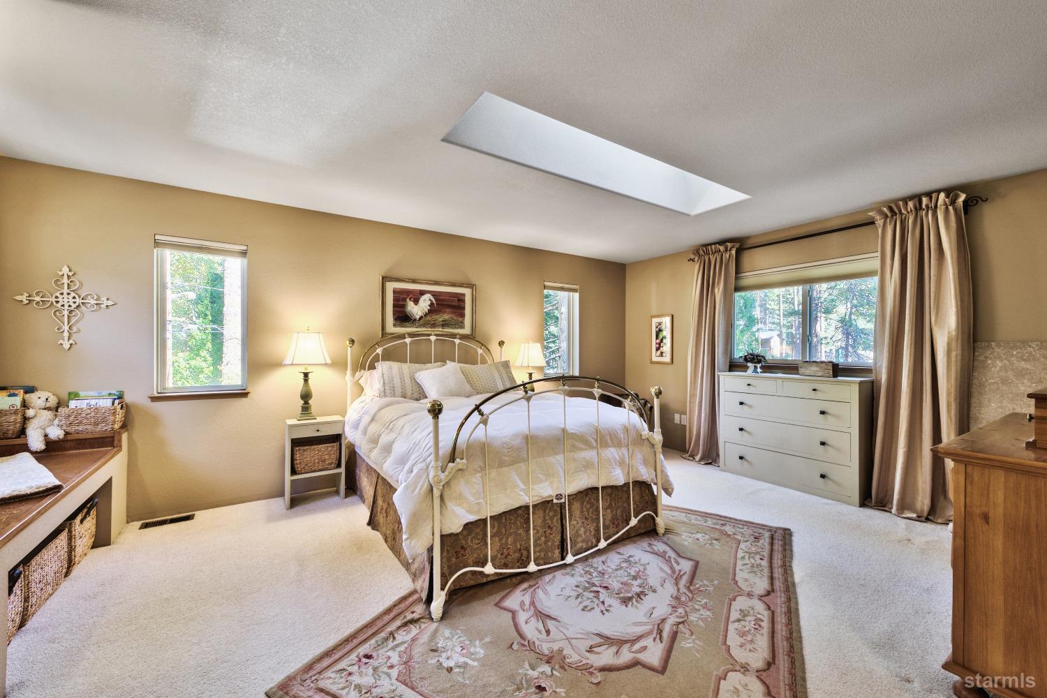 712 Sand Harbor Road South Lake Tahoe, CA 96150 - Photo 21 of 38 a bed room with a bed and a window