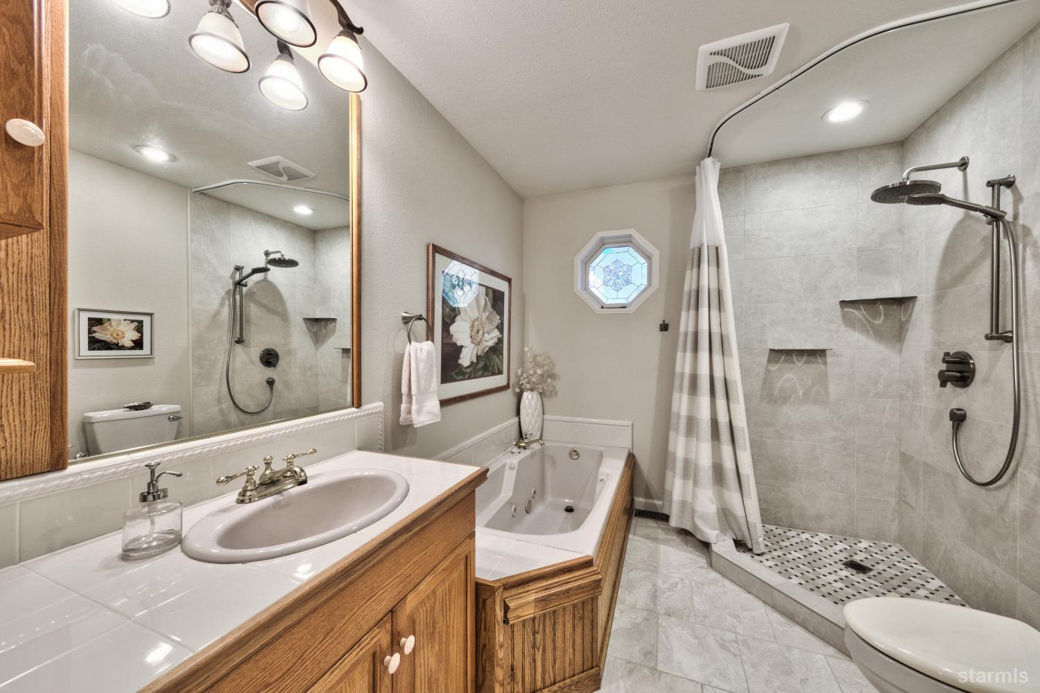 712 Sand Harbor Road South Lake Tahoe, CA 96150 - Photo 22 of 38 a bathroom with a sink double vanity and shower