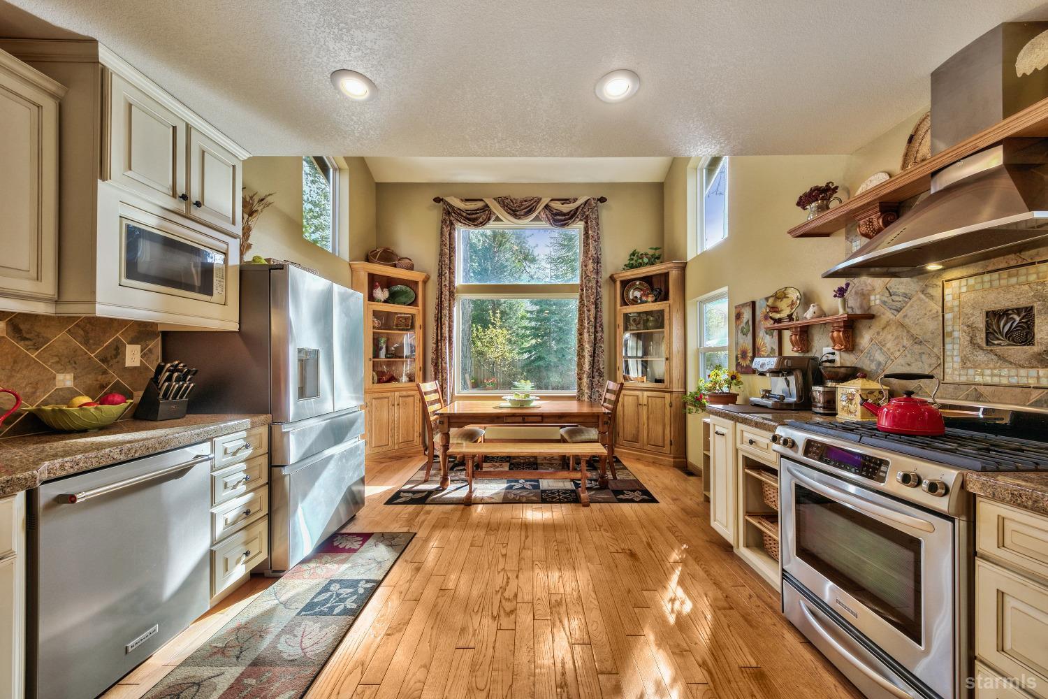 712 Sand Harbor Road South Lake Tahoe, CA 96150 - Photo 28 of 38 a kitchen with stainless steel appliances a stove a sink and a refrigerator