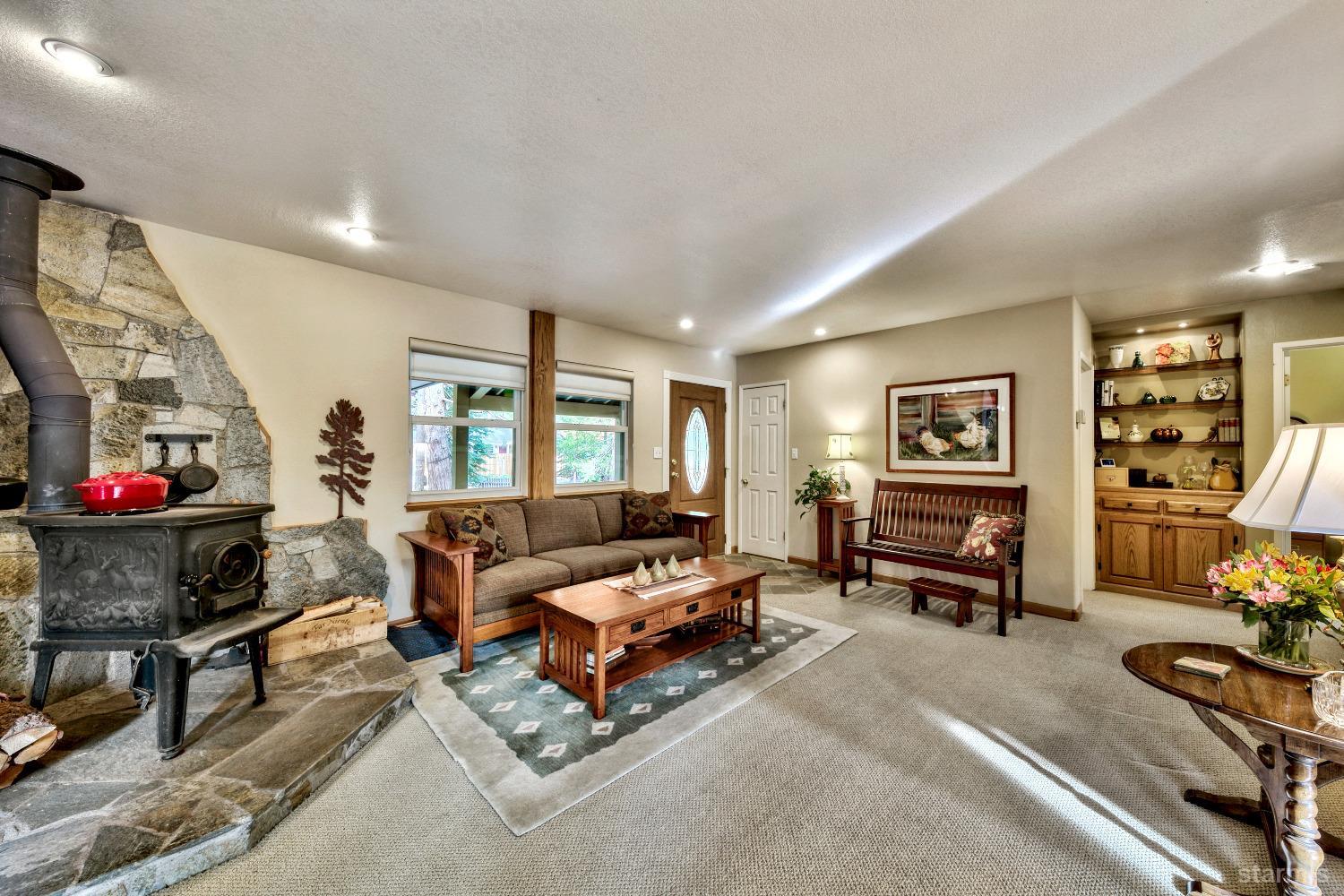 712 Sand Harbor Road South Lake Tahoe, CA 96150 - Photo 30 of 38 a living room with furniture and a flat screen tv