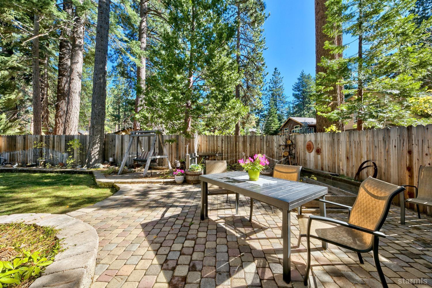 712 Sand Harbor Road South Lake Tahoe, CA 96150 - Photo 10 of 38 a backyard of a house with table and chairs