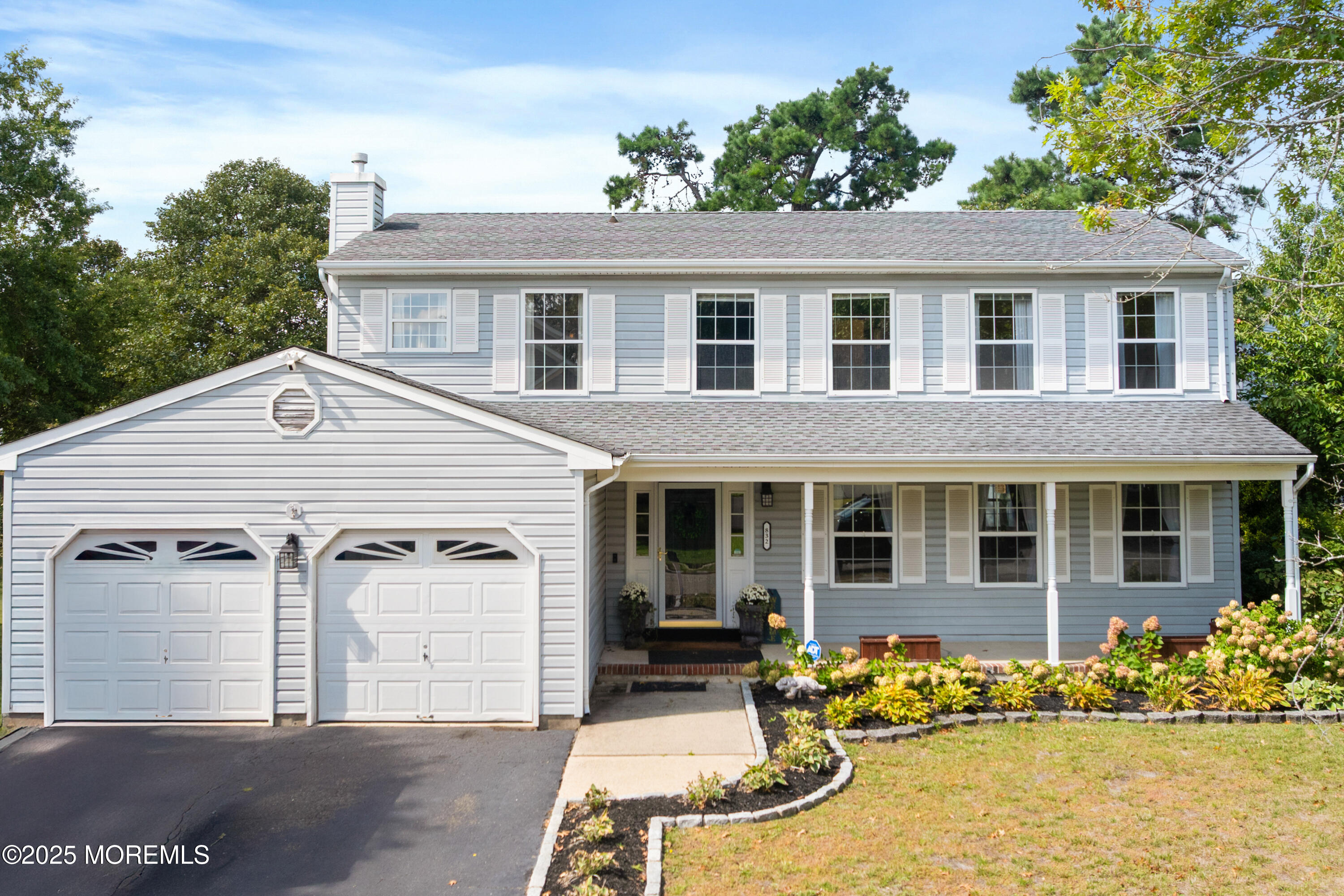 832 Constitution Drive Brick, NJ 08724 - Photo 1 of 24 front view of a house with a large window and potted plants