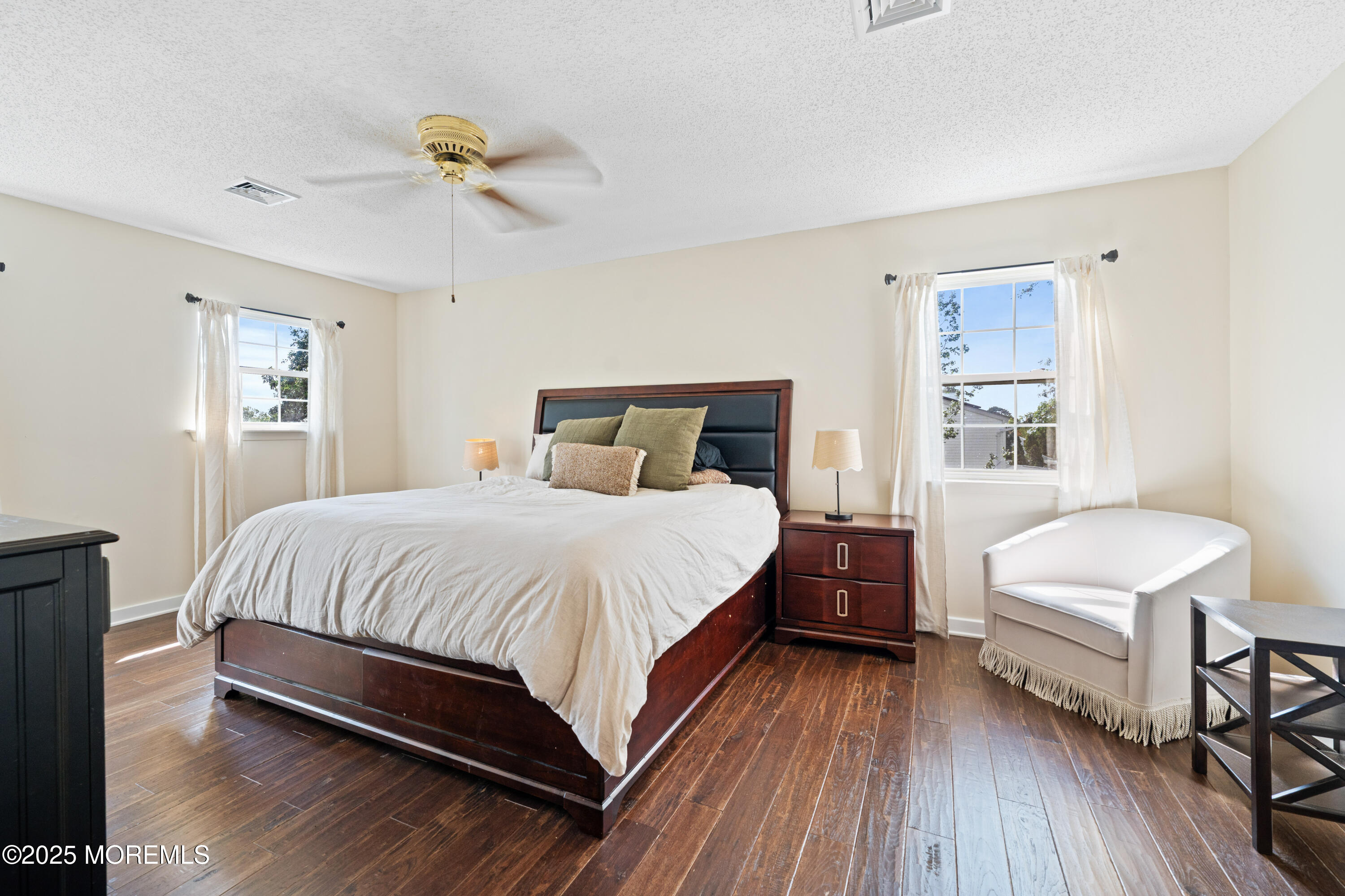 832 Constitution Drive Brick, NJ 08724 - Photo 19 of 24 a bedroom with a bed and a chandelier