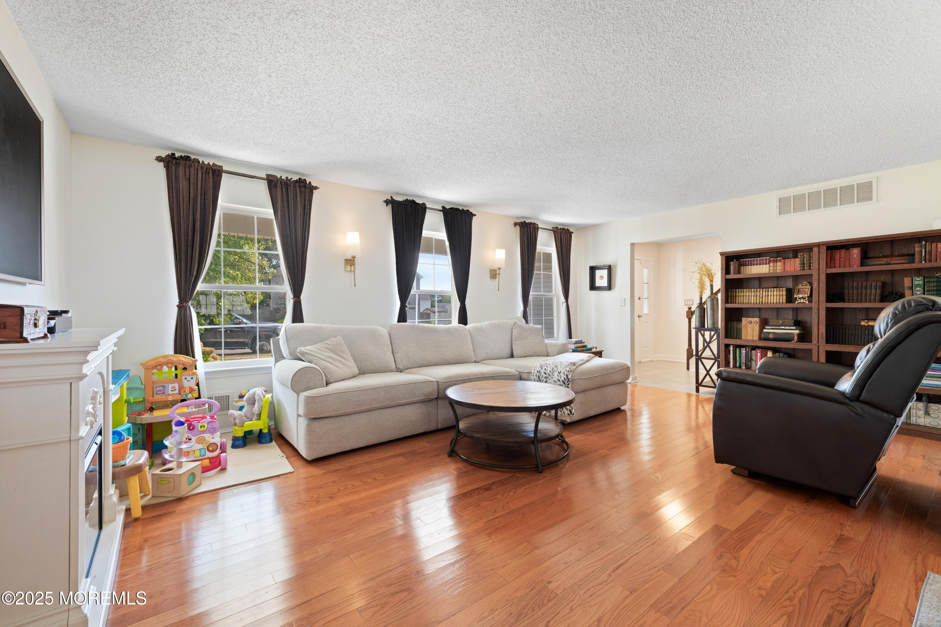 832 Constitution Drive Brick, NJ 08724 - Photo 4 of 24 a living room with furniture and a wooden floor