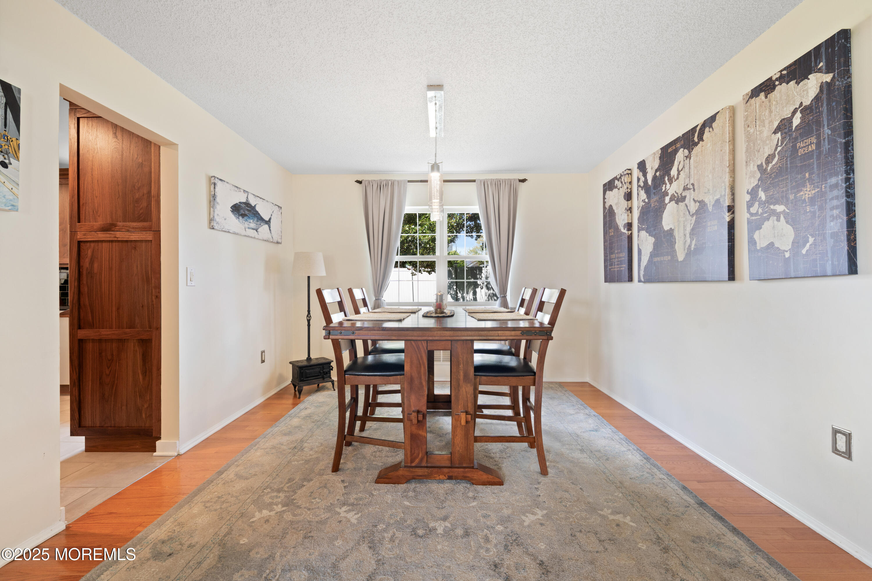 832 Constitution Drive Brick, NJ 08724 - Photo 5 of 24 a dining room with furniture a rug and wooden floor