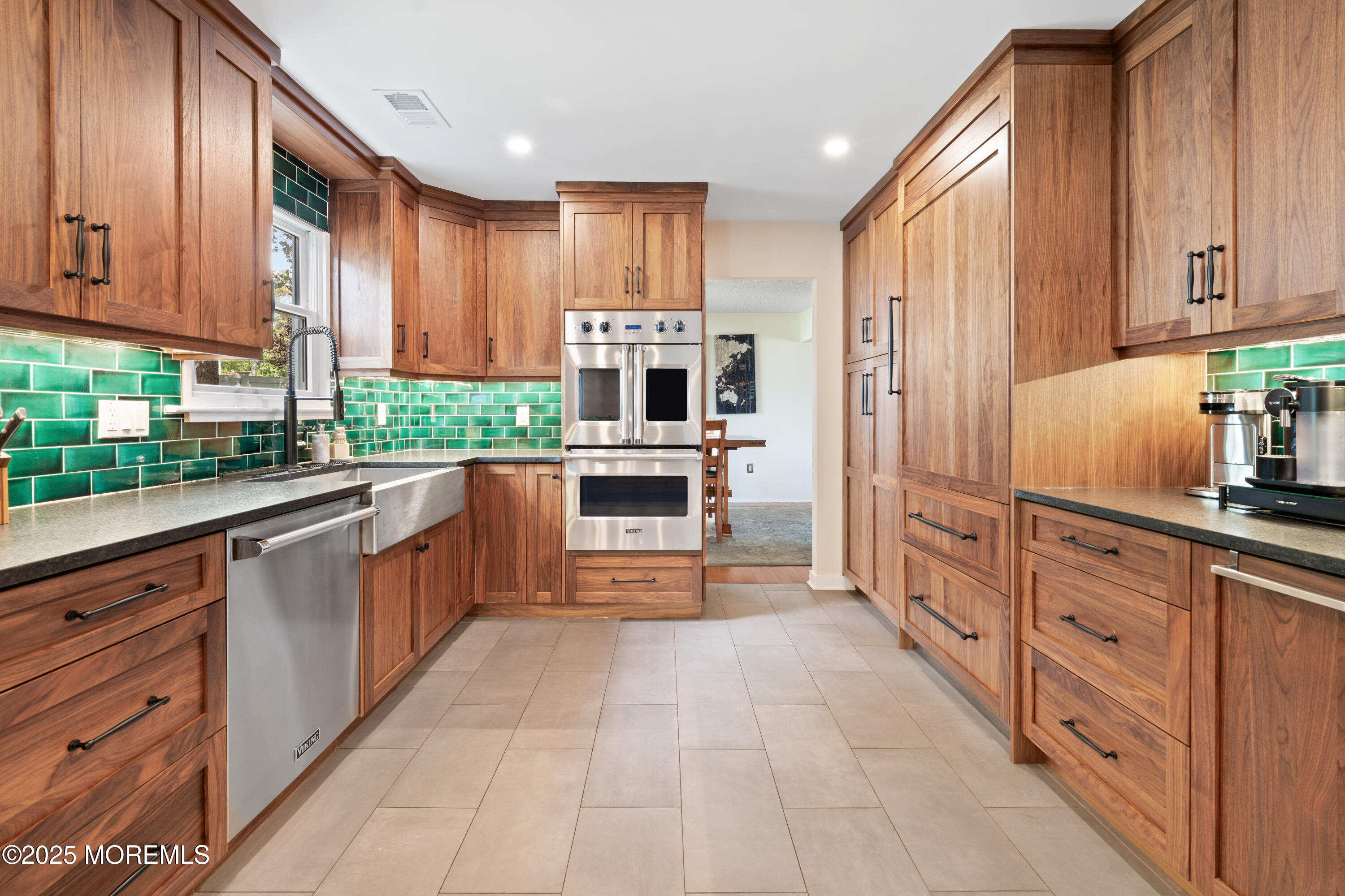 832 Constitution Drive Brick, NJ 08724 - Photo 8 of 24 a kitchen with stainless steel appliances a refrigerator sink and cabinets
