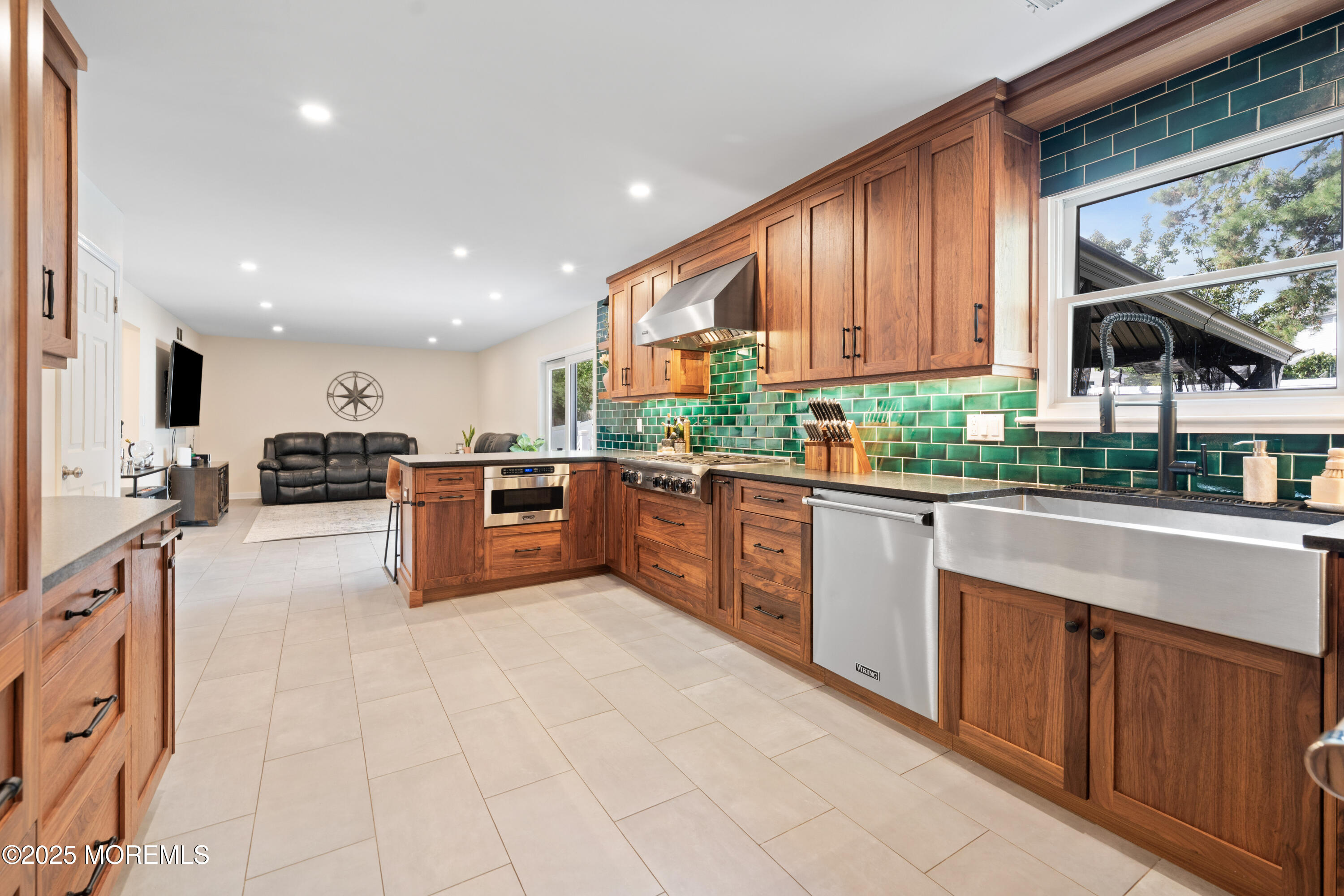 832 Constitution Drive Brick, NJ 08724 - Photo 10 of 24 a kitchen with stainless steel appliances granite countertop a stove a sink and a microwave