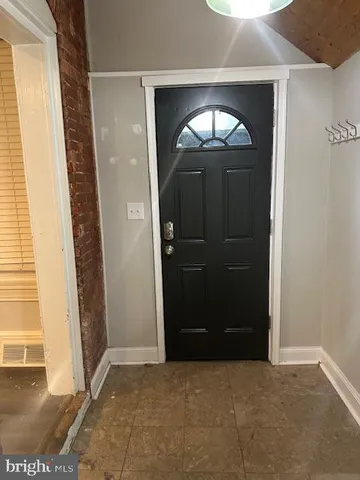 an empty room with mirror