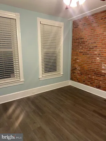 a view of kitchen with wooden floor