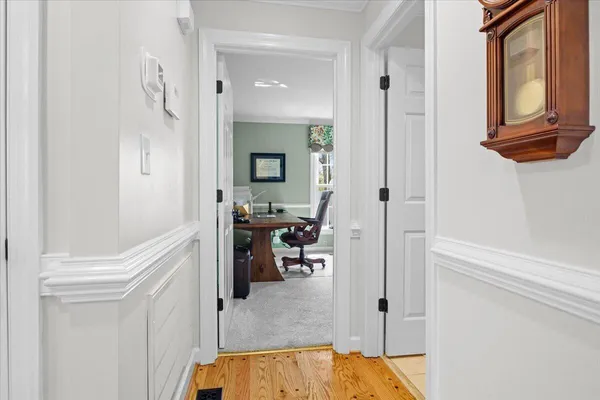 a bathroom with a granite countertop sink and a large mirror