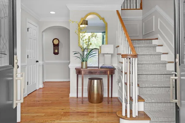 a kitchen with stainless steel appliances kitchen island granite countertop a refrigerator and a stove top oven