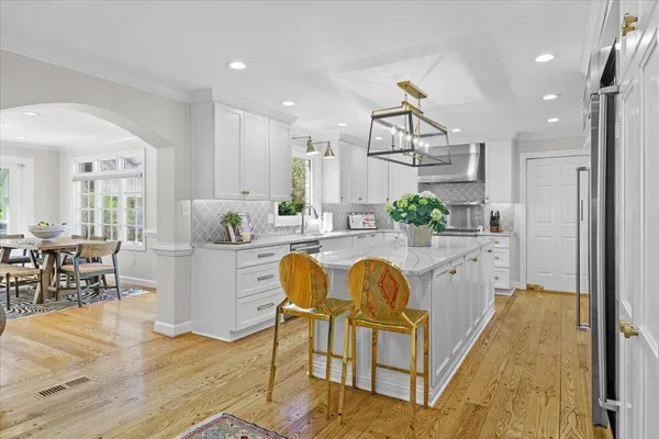 a kitchen with appliances and cabinets