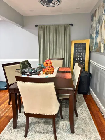 a dining room with furniture and window