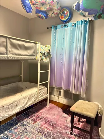 a bed room with a bed and a chair