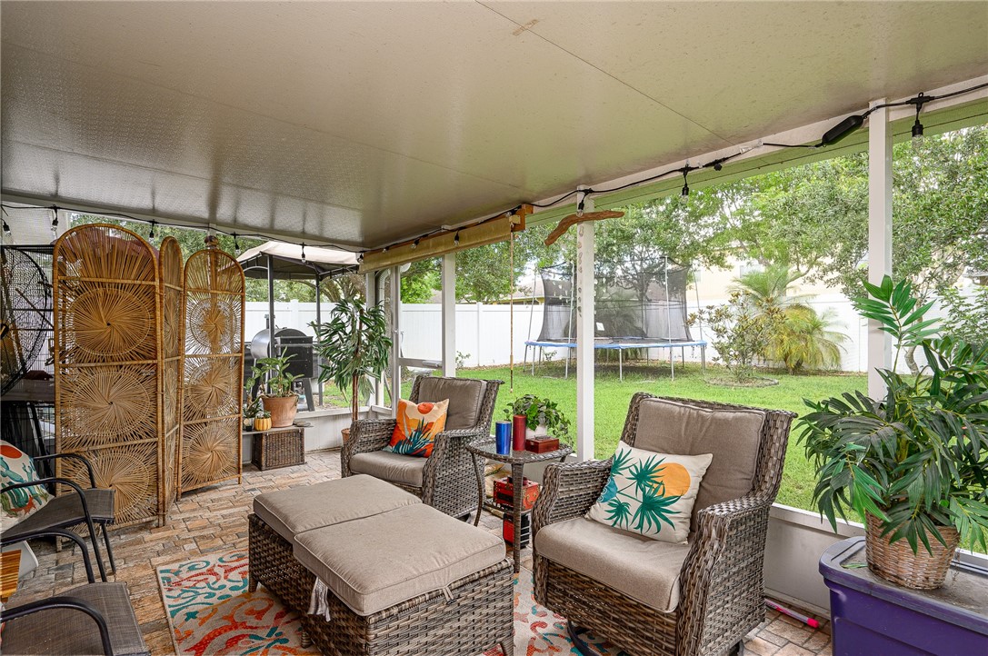 114 Drake Way Sebastian, FL 32958 - Photo 21 of 34 a outdoor space with patio the couches and a dining table with garden view