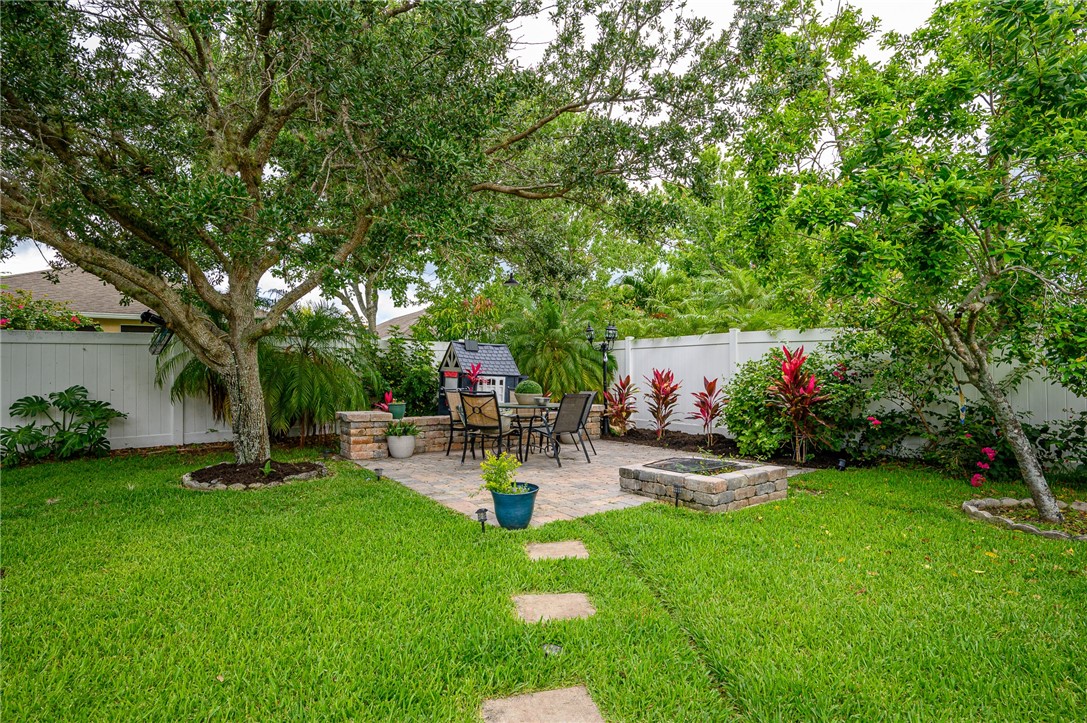 114 Drake Way Sebastian, FL 32958 - Photo 23 of 34 a view of a backyard with sitting area