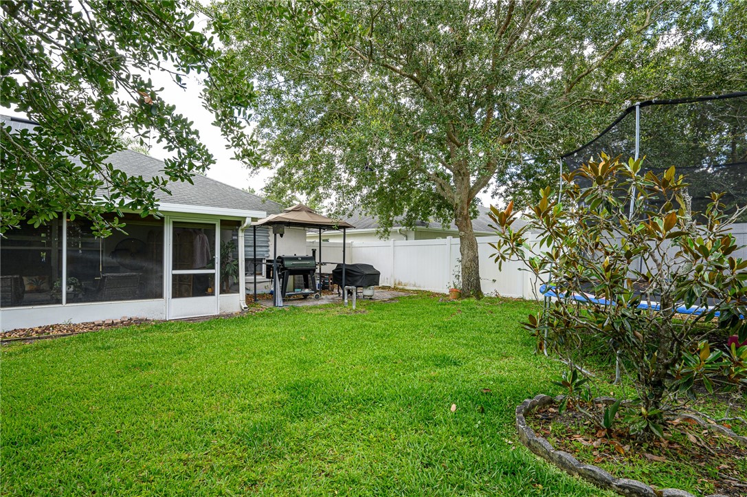 114 Drake Way Sebastian, FL 32958 - Photo 26 of 34 a view of a house with a yard porch and sitting area