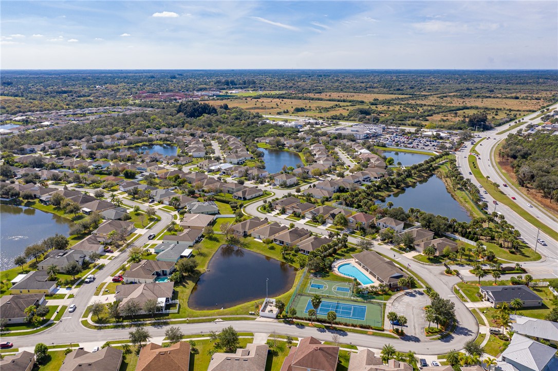 114 Drake Way Sebastian, FL 32958 - Photo 30 of 34 an aerial view of residential building with parking