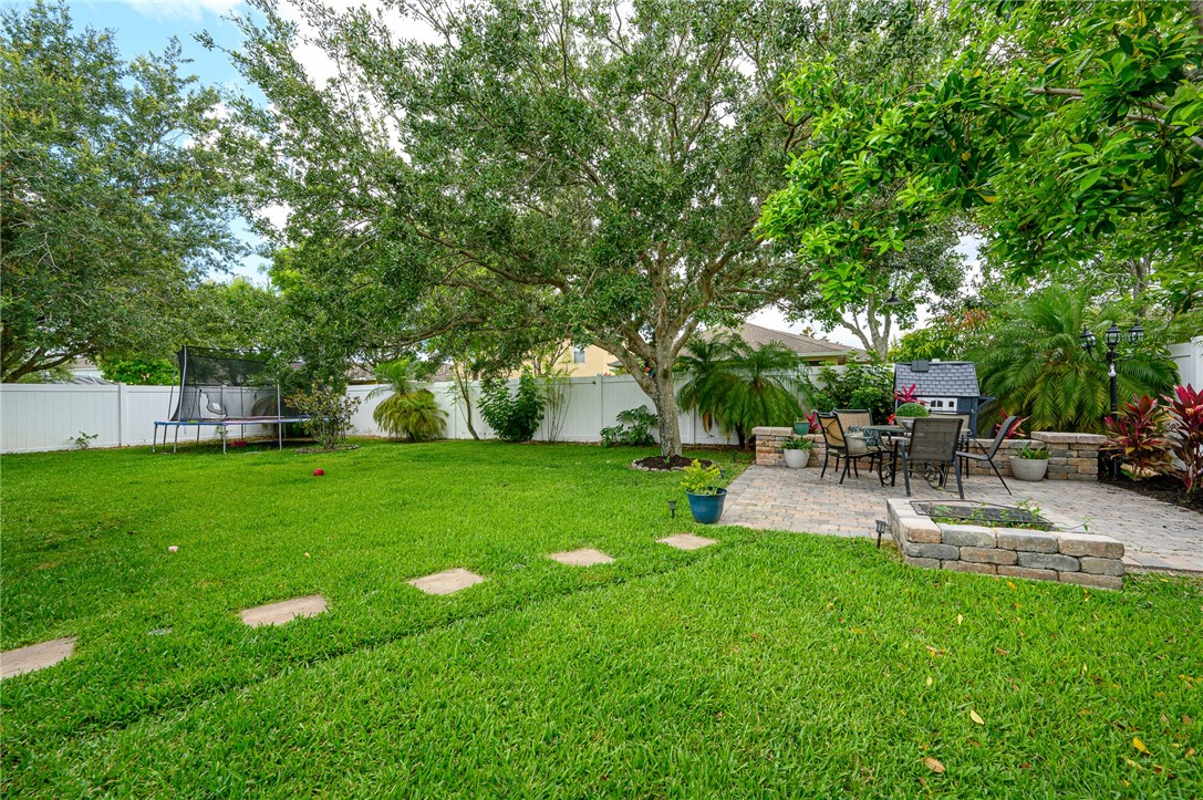 114 Drake Way Sebastian, FL 32958 - Photo 31 of 34 a view of a backyard with sitting area
