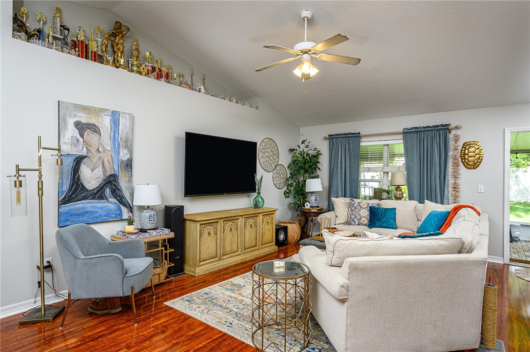 114 Drake Way Sebastian, FL 32958 - Photo 7 of 34 a living room with furniture and a flat screen tv