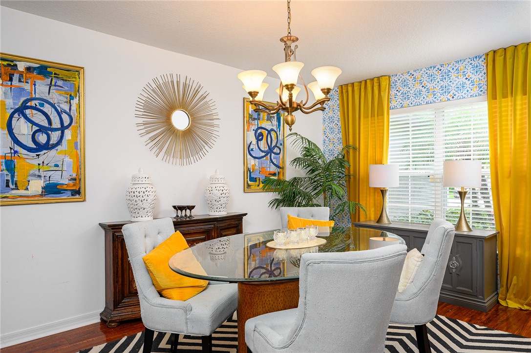 114 Drake Way Sebastian, FL 32958 - Photo 9 of 34 a view of a dining room with furniture wooden floor and chandelier