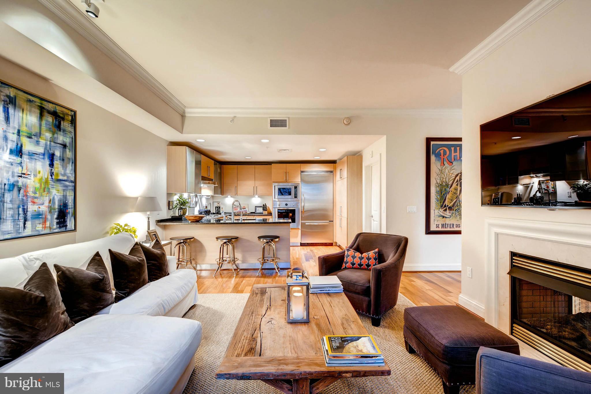 a living room with furniture fireplace and flat screen tv