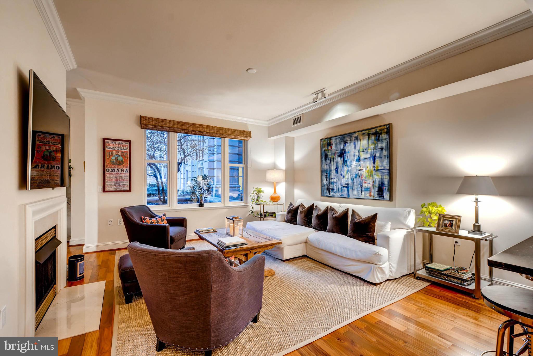 801 Key Highway, Unit 122 Baltimore, MD 21230 - Photo 2 of 30 a living room with furniture fireplace and a large window