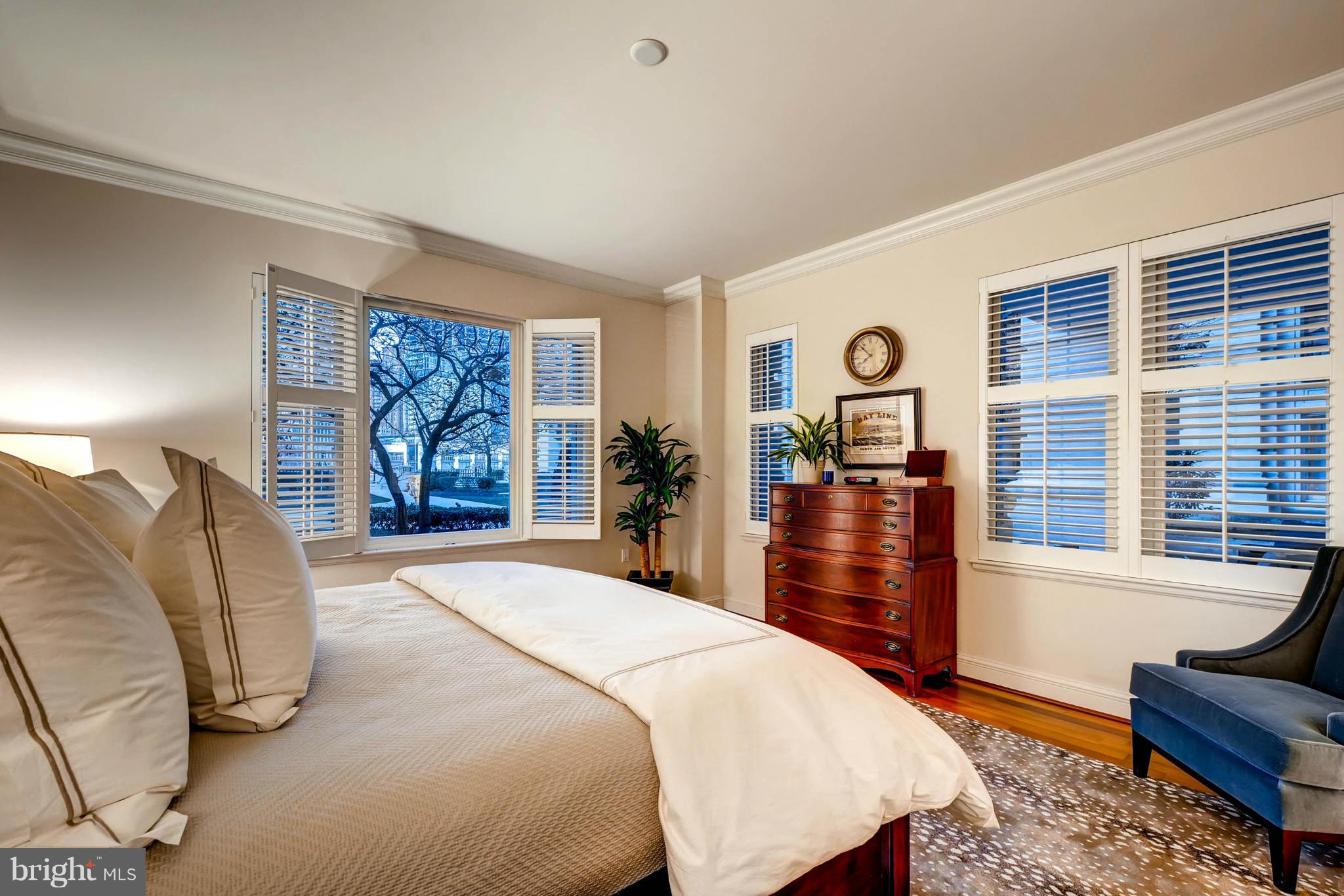 801 Key Highway, Unit 122 Baltimore, MD 21230 - Photo 17 of 30 a bedroom with a large bed and a window