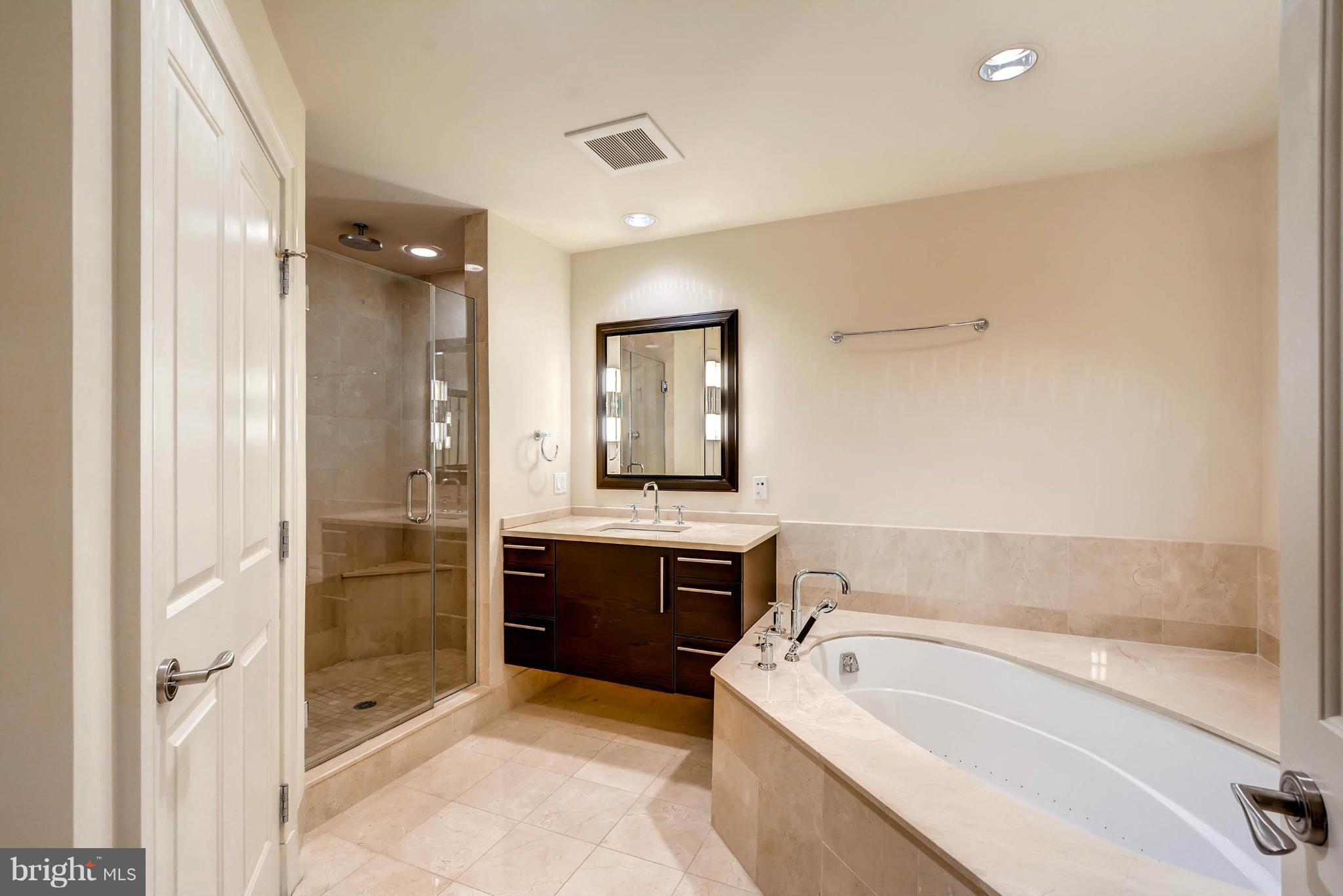 801 Key Highway, Unit 122 Baltimore, MD 21230 - Photo 19 of 30 a bathroom with a bathtub and a sink