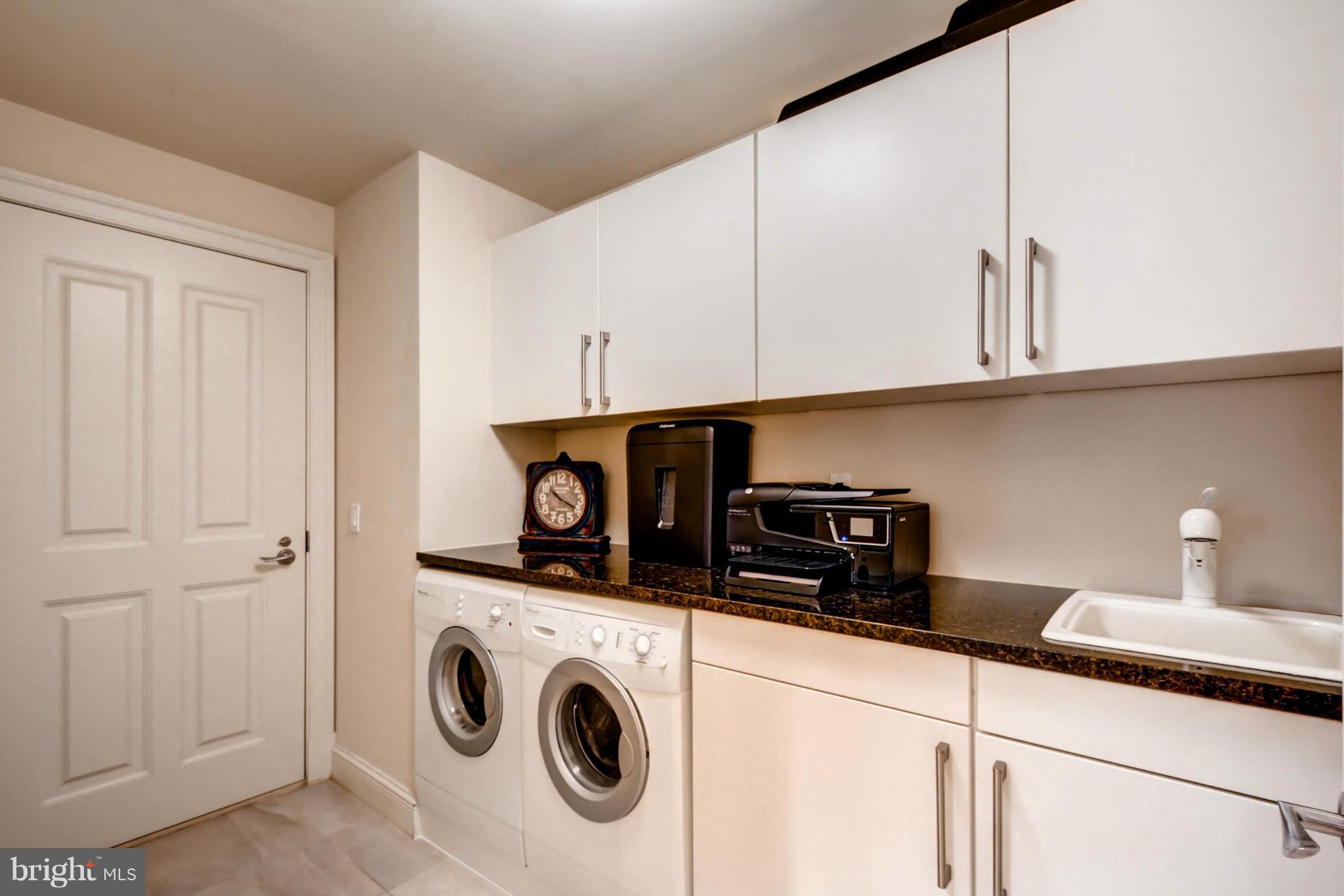 801 Key Highway, Unit 122 Baltimore, MD 21230 - Photo 22 of 30 a utility room with dryer and washer