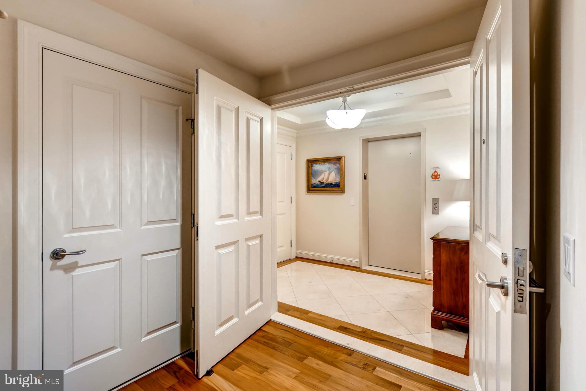 801 Key Highway, Unit 122 Baltimore, MD 21230 - Photo 23 of 30 a view of a hallway with wooden floor and entryway