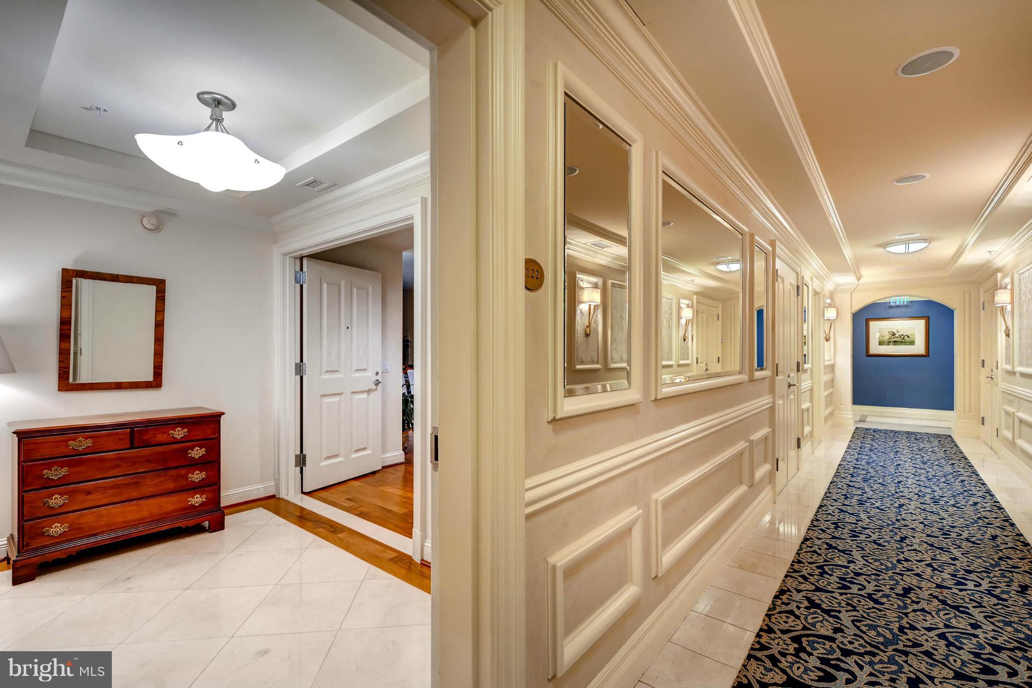 801 Key Highway, Unit 122 Baltimore, MD 21230 - Photo 24 of 30 a view of a hallway with wooden floor and staircase