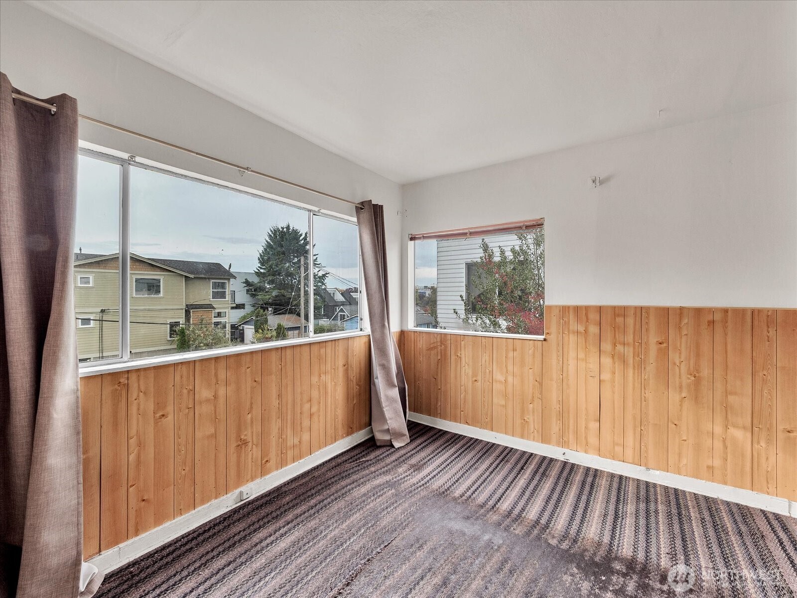 203 23rd Avenue Seattle, WA 98122 - Photo 15 of 26 a view of a room with wooden floor and windows
