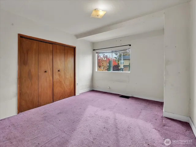 a view of kitchen and refrigerator