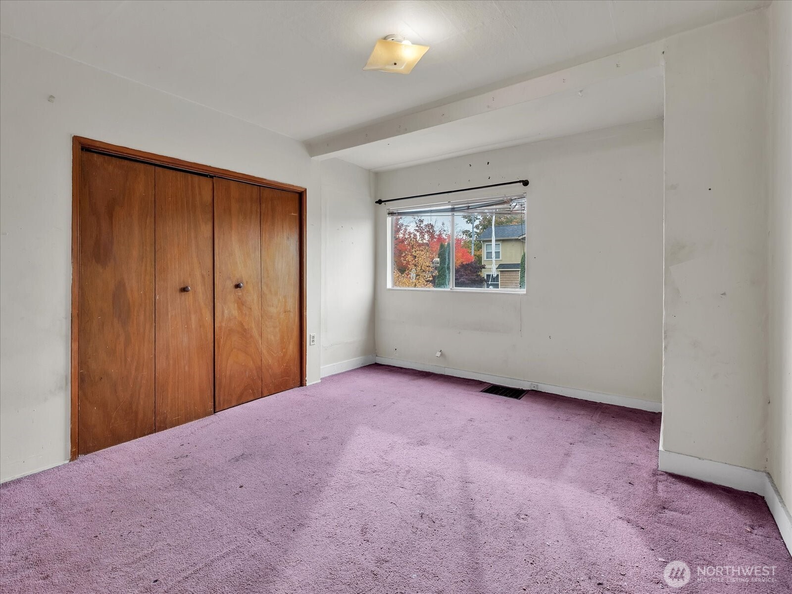 203 23rd Avenue Seattle, WA 98122 - Photo 10 of 26 a view of an empty room with a window