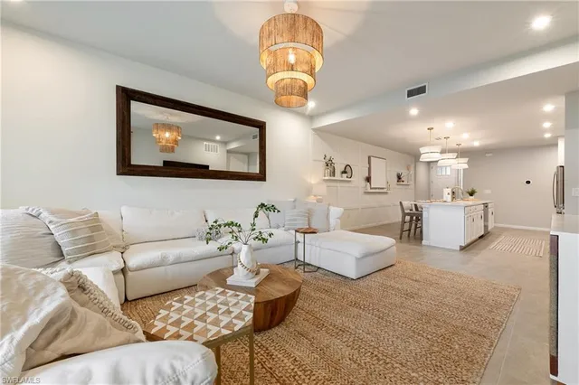 a kitchen with kitchen island a sink appliances and cabinets