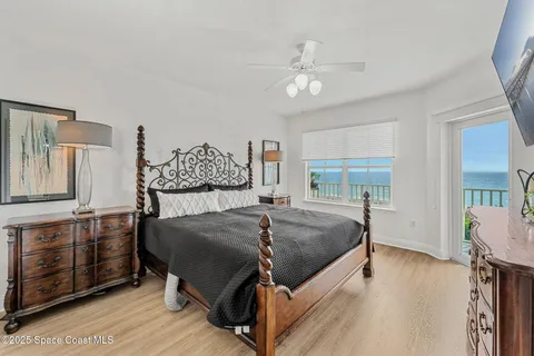 a bed room with a bed and a chandelier