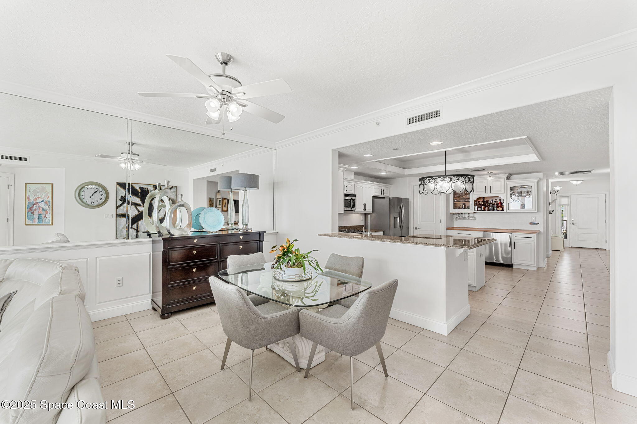 505 South Miramar Avenue, Unit 2403 Indialantic, FL 32903 - Photo 13 of 43 a living room with furniture and kitchen view