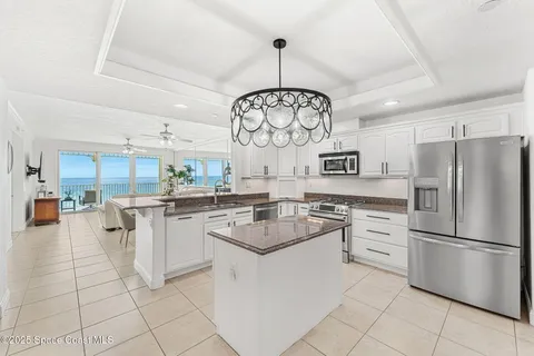 a kitchen with cabinets and stainless steel appliances
