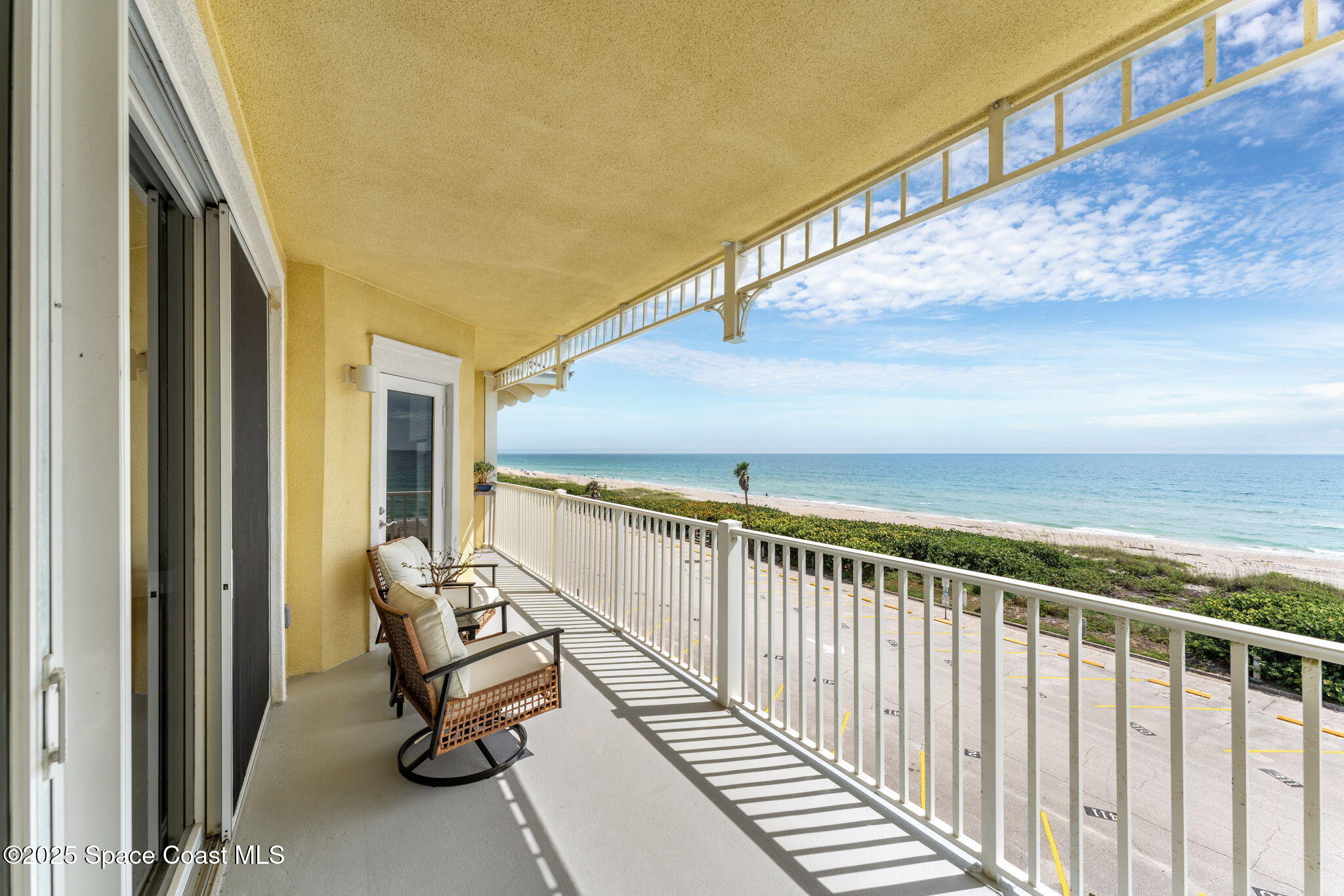 505 South Miramar Avenue, Unit 2403 Indialantic, FL 32903 - Photo 16 of 43 a view of a balcony with chairs