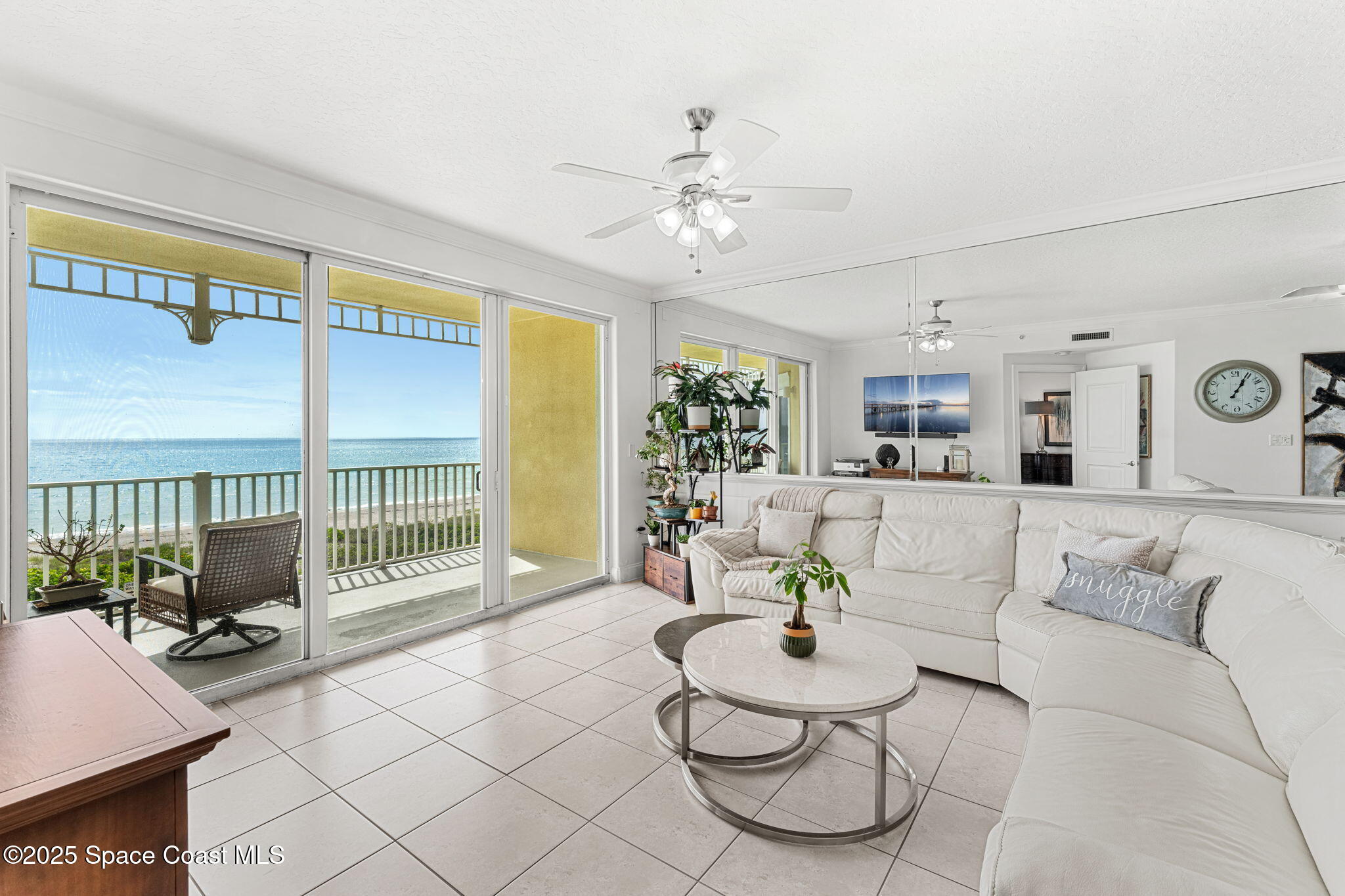 505 South Miramar Avenue, Unit 2403 Indialantic, FL 32903 - Photo 18 of 43 a living room with furniture and a large window
