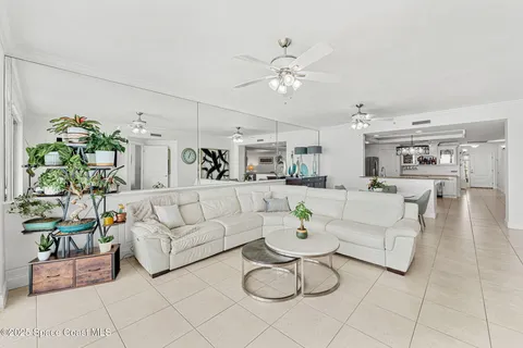 a living room with furniture and white walls
