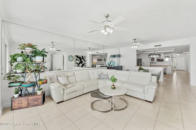 a living room with furniture and white walls