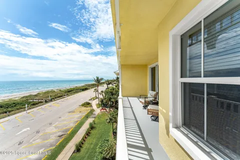 a view of a balcony with ocean view