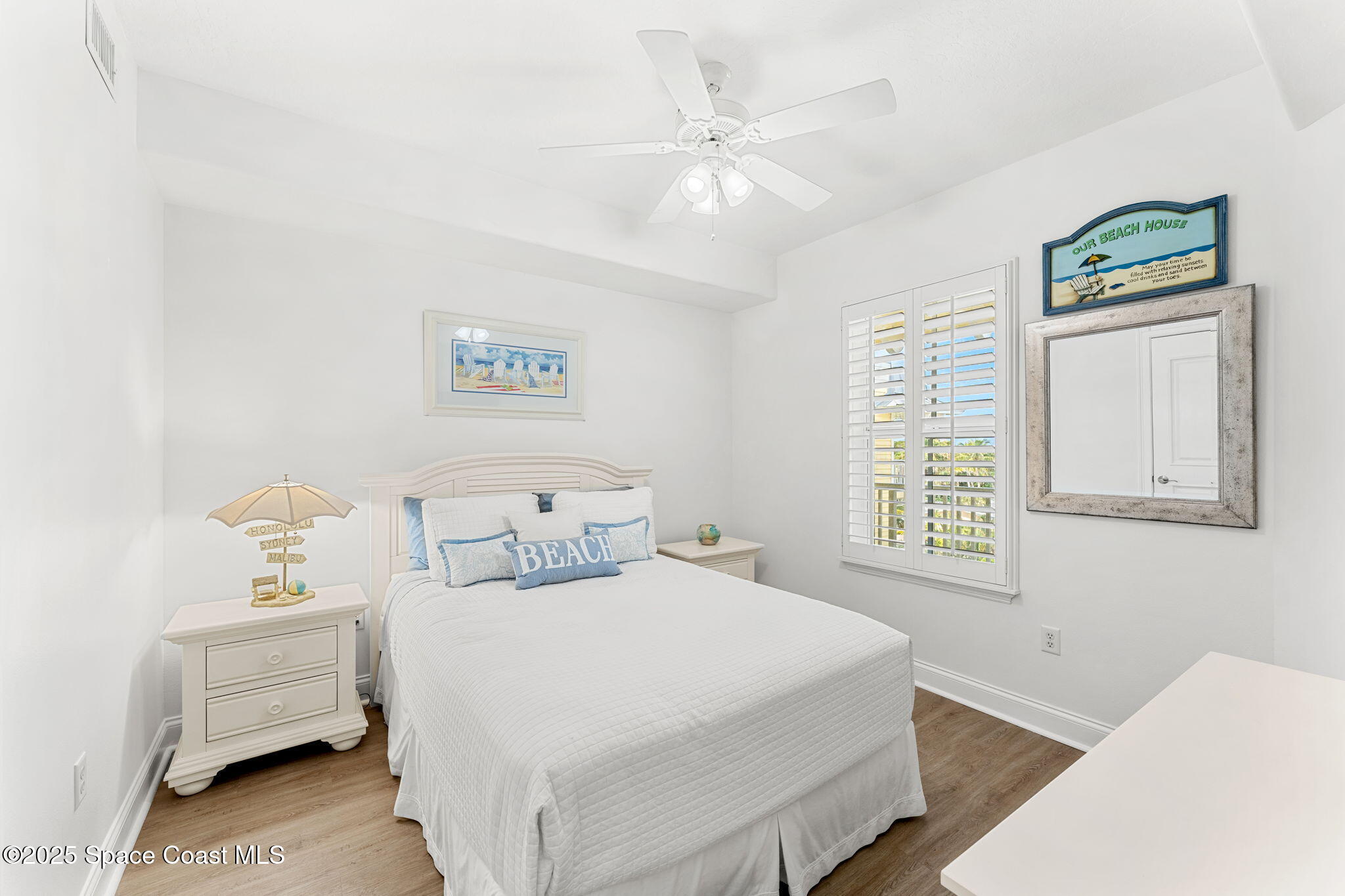 505 South Miramar Avenue, Unit 2403 Indialantic, FL 32903 - Photo 26 of 43 a bedroom with a bed and a window