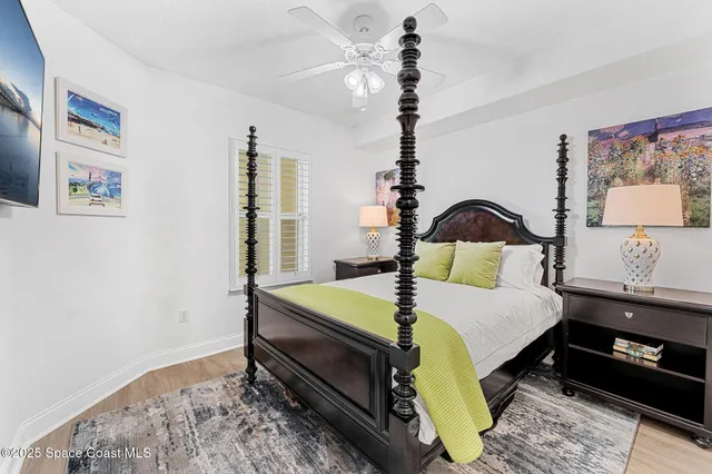 a bedroom with a bed dresser and window