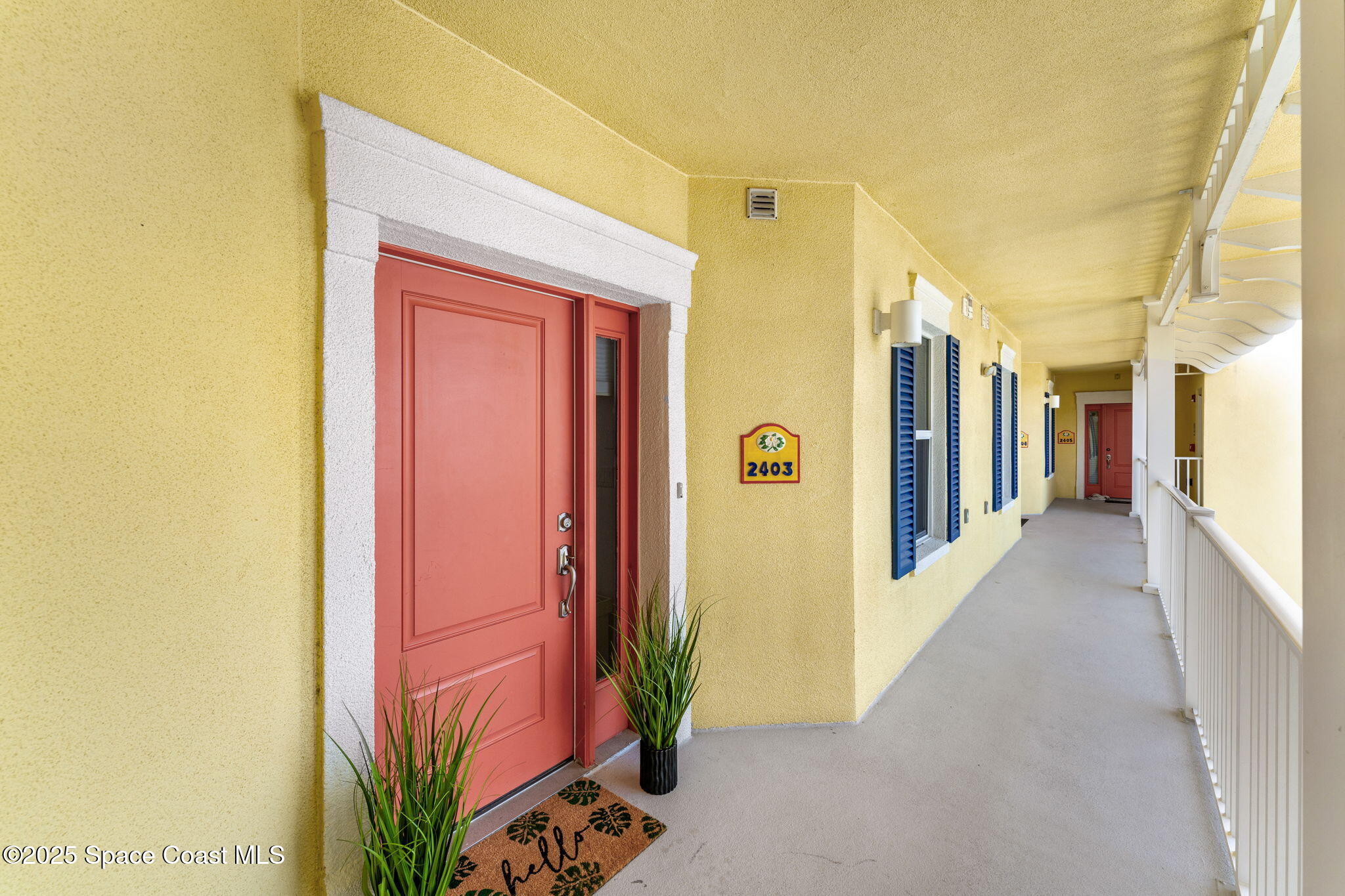 505 South Miramar Avenue, Unit 2403 Indialantic, FL 32903 - Photo 31 of 43 a view of a hallway with wooden shelves