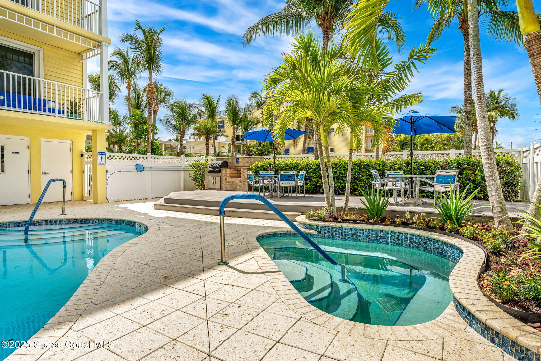 505 South Miramar Avenue, Unit 2403 Indialantic, FL 32903 - Photo 34 of 43 a view of a swimming pool with a lounge chair