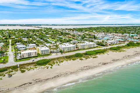 a picture of a bench in room with a white wall